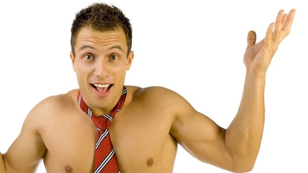 Smiling bare-chested man wearing a tie and shrugging comically
