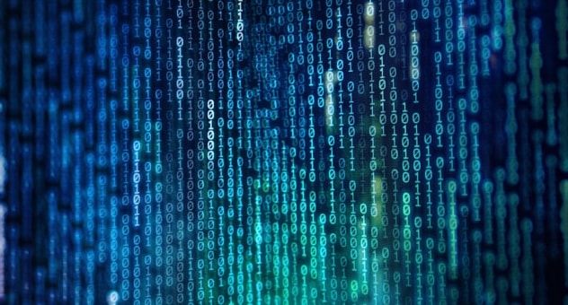 colourful binary code data on computer monitor