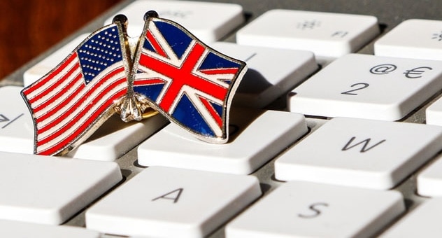 Badge shaped like US and UK flags on keyboard