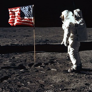 Astronaut and American flag at first landing on the moon