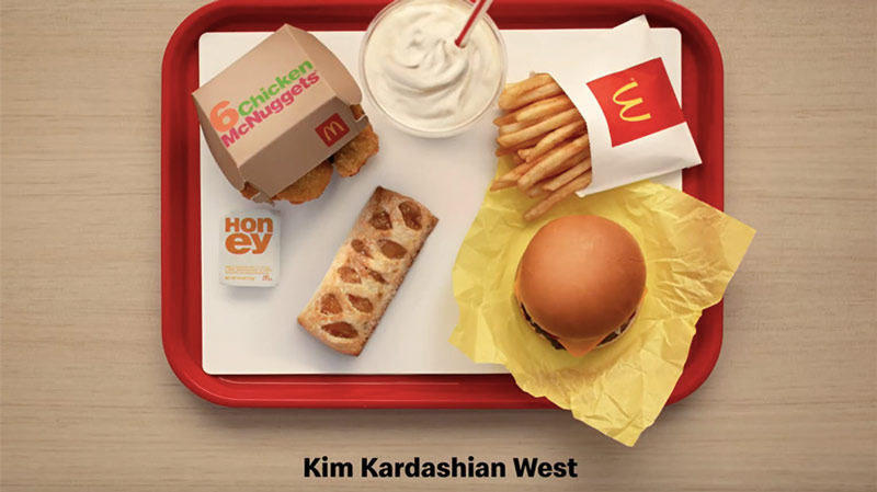 McDonald's tray with Chicken McNuggets, burger, shake and small fries and caption reading 'Kim Kardashian West'