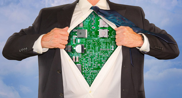 A man in a suit rips open his shirt, revealing a circuit board.