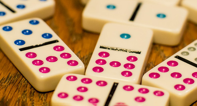 Dominoes with blue and pink dots.