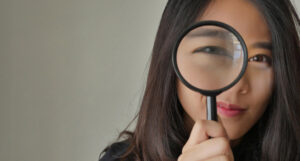 Woman magnifying glass